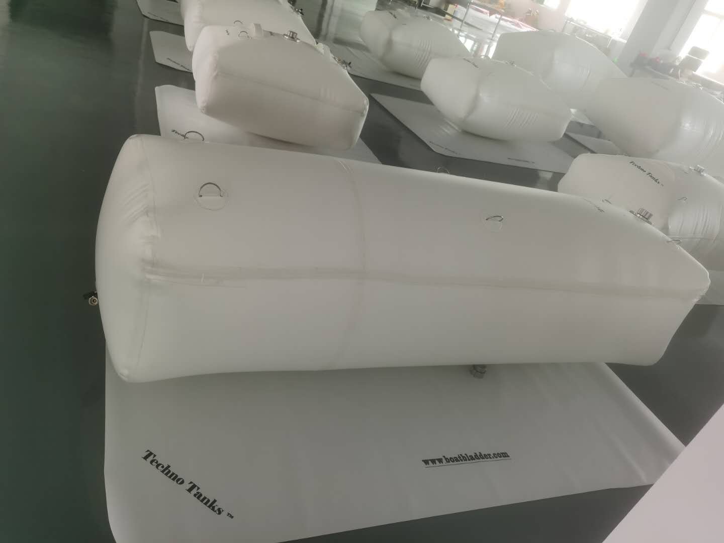 marine fuel bladder over mat